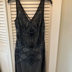 Black beaded, sleeveless,V Neckline front/back.